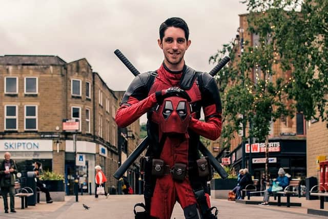 Champion fundraiser Jack Walsh prepares to be transformed into Marvel superhero Deadpool. (pic by Naz Alam)