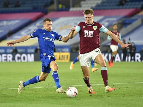 Jamie Vardy of Leicester City battles for possession with Jimmy Dunne of Burnley during the Premier League match between Leicester City and Burnley at The King Power Stadium on September 20, 2020 in Leicester, England. (Photo by Peter Powell - Pool/Getty Images)