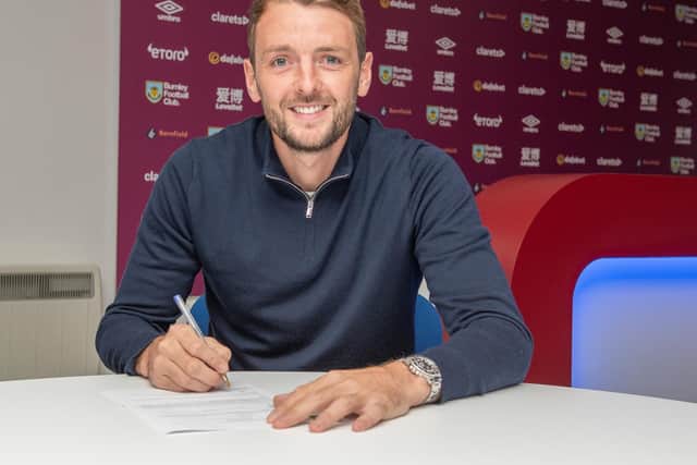 Dale Stephens signs on. PICTURE: Burnley FC