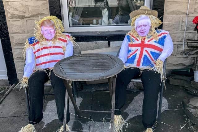 The Boris Johnson and Donald Trump scarecrows made by residents as part of the Rosegrove scarecrow festival this summer