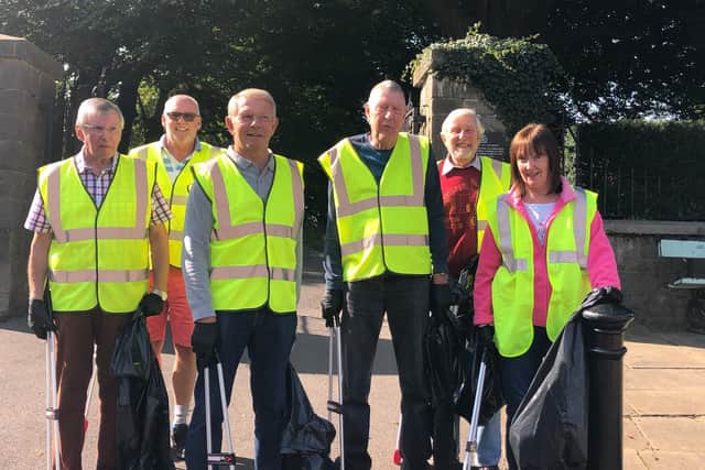 Mr Ian Lloyd (second left) with his army of volunteers ensuring the cleanliness of the town's streets/parks