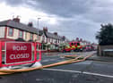 Firefighters help out after flooding forced people out of their homes in Blackpool earlier this year