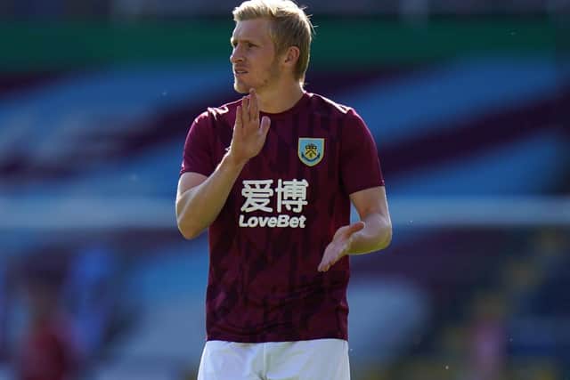 Ben Mee of Burnley warms up prior to the Premier League match between Burnley FC and Watford FC at Turf Moor on June 25, 2020 in Burnley, United Kingdom.