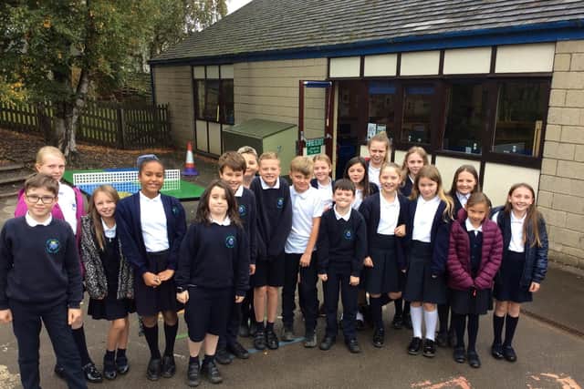 These pupils from Read's St John's Primary School are hoping their letters will help to save 30 trees threatened with the chop to make way for a tram line.