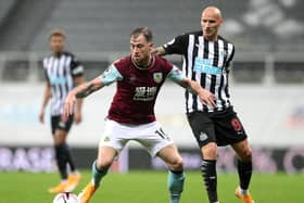 Ashley Barnes of Burnley is challenged by Jonjo Shelvey of Newcastle United during the Premier League match between Newcastle United and Burnley at St. James Park on October 03, 2020 in Newcastle upon Tyne, England. (Photo by Scott Heppell - Pool/Getty Images)