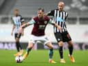 Ashley Barnes of Burnley is challenged by Jonjo Shelvey of Newcastle United during the Premier League match between Newcastle United and Burnley at St. James Park on October 03, 2020 in Newcastle upon Tyne, England. (Photo by Scott Heppell - Pool/Getty Images)