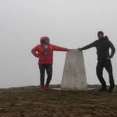 The trig point at Pendle Hill is going to be a very familiar sight to Scott Pickles (left) and Deehan during their plan to lap the hill as many times as possible in 24 hours