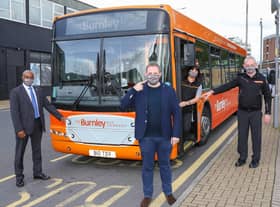Burnley MP Antony Higginbotham (centre) joins staff from The Burnley Bus Company to remind customers that unless they are legally exempt, wearing a face covering is mandatory on all bus journeys