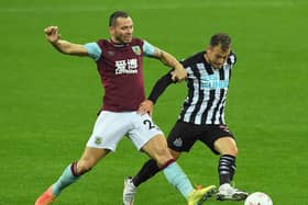 Phil Bardsley of Burnley battles for possession with Ryan Fraser of Newcastle United during the Premier League match between Newcastle United and Burnley at St. James Park on October 03, 2020 in Newcastle upon Tyne, England.