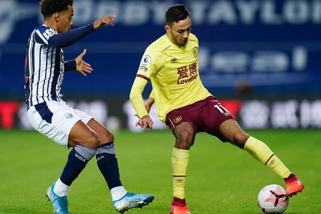 Dwight McNeil of Burnley controls the ball under pressure from Matheus Pereira of West Bromwich Albion during the Premier League match between West Bromwich Albion and Burnley at The Hawthorns on October 19, 2020 in West Bromwich, England.