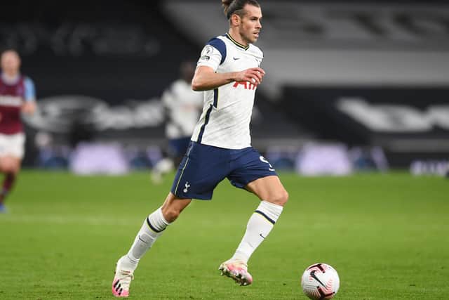 Gareth Bale of Tottenham Hotspur runs with the ball during the Premier League match between Tottenham Hotspur and West Ham United at Tottenham Hotspur Stadium on October 18, 2020 in London, England.