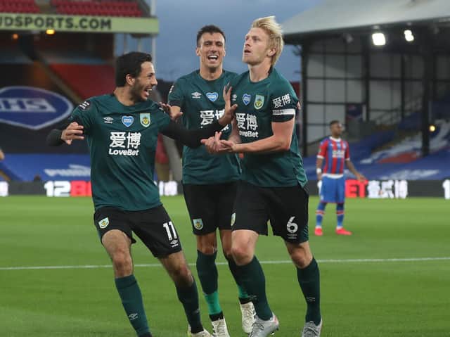 Ben Mee, right, celebrates scoring the winner on his last appearance at Crystal Palace at the end of June