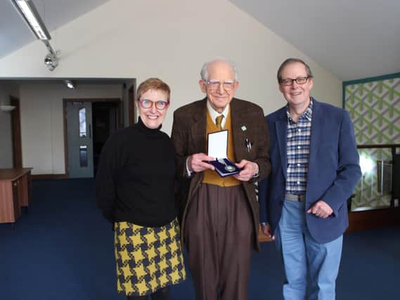 Crispin Truman OBE, Chief Exec of CPRE (right) and Debbie McConnell (left) present former Liverpool University professor Dr Des Brennan the Countryside Medal, CPRE's prestigious Volunteer Award