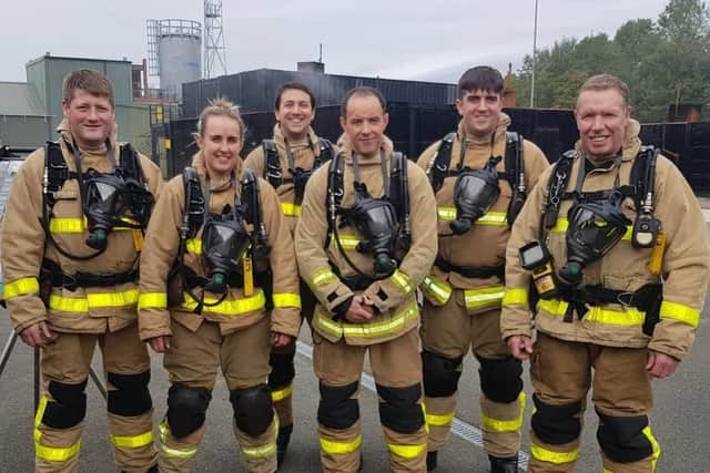 Firefighter Alan Ashworth (far right) with colleagues at Padiham Fire Station