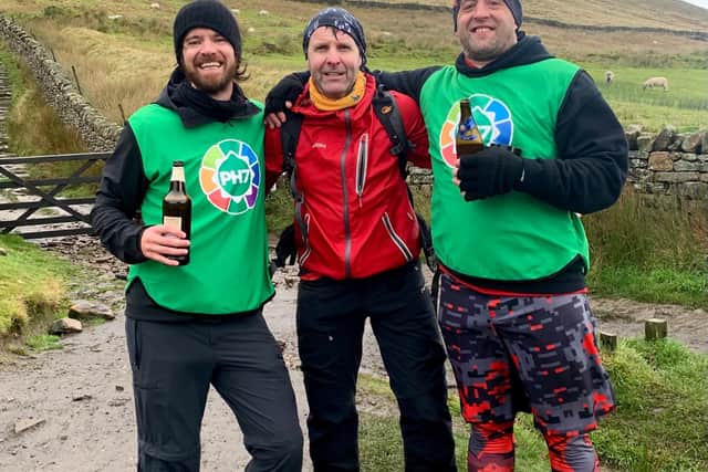Garry Wilkinson (centre) joined Scott and John to complete 20 laps of Pendle with them