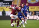Ashley Westwood of Burnley battles for possession with Mason Mount of Chelsea during the Premier League match between Burnley and Chelsea at Turf Moor on October 31, 2020 in Burnley, England.