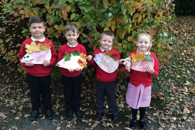 Students Bobby, Jack, Cody and Scarlett proudly show off  their leaf hedgehogs