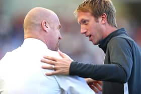 Graham Potter, Manager of Brighton and Hove Albion greets Sean Dyche, Manager of Burnley prior to the Premier League match between Brighton & Hove Albion and Burnley FC at American Express Community Stadium