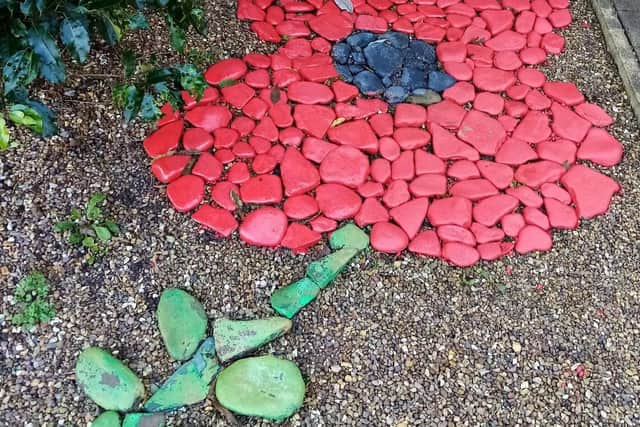 The stunning poppy Alan Earnshaw created using rocks in the garden of his Padiham home.