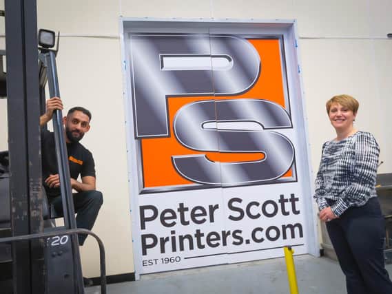 Apprentice Waqas Ahmed with Joanne Hindley, commercial director at Peter Scott Printers