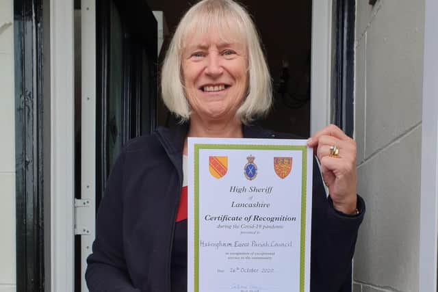 Coun. Pat Osbaldeston with the certificate of recognition from the High Sheriff of Lancashire.