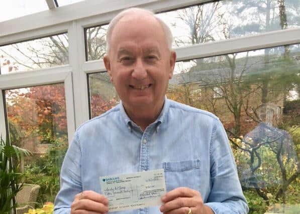 Third prize winner Andy McIlroy with his cheque for £50
