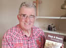 John Cowell with his new book