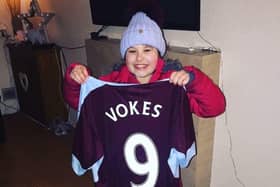 Nadia Sattar proudly shows off the shirt Sam Vokes presented to her