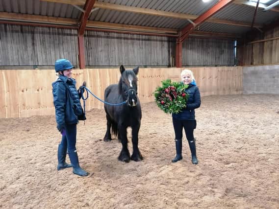 HAPPA’s head of equine operations, Amanda Berry shows off one of the beautiful wreaths you could make, with HAPPA Doris Day and senior equine care officer, Kelly Laird.