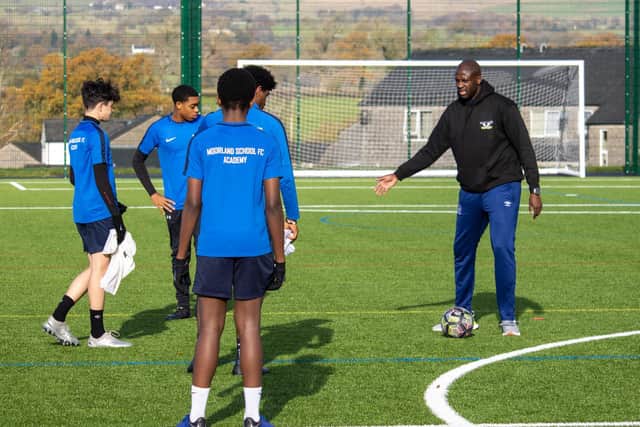 Premier League legend Yaya Toure gives pupils at Moorland School some help and advice