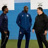 Former Manchester City and Barcelona ace Yaya Toure chats to former Manchester United forward John Cofie (left) and Head of Football Development Charlie Jackson.