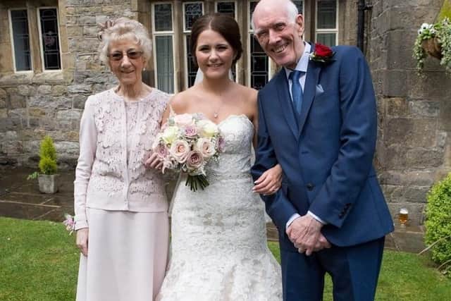 Ronald and Dorothy with their granddaughter Sarah on her wedding day