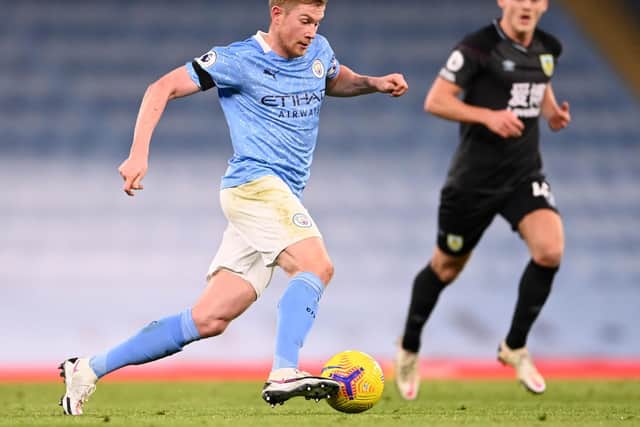 Burnley debutant Josh Benson keeps tabs on Manchester City midfielder Kevin de Bruyne during the Premier League match between Manchester City and Burnley at Etihad Stadium on November 28, 2020 in Manchester, England.