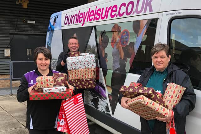 Burnley Leisure staff (from left to right) Michelle Grimes, Mark Dempsey and Janet Roundell support the annual Christmas Toy Appeal.