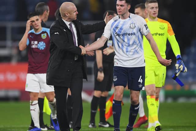 Sean Dyche, Manager of Burnley shakes hands with Michael Keane of Everton after the Premier League match between Burnley FC and Everton FC at Turf Moor on December 26, 2018 in Burnley, United Kingdom.