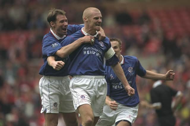 Sean Dyche of Chesterfield receives the congratulations for his goal during the FA Cup Semi-Final against Middlesbrough at Old Trafford in Manchester, England. The game was drawn 3-3.