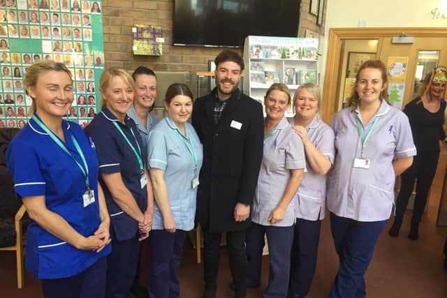 Jordan with staff at Pendleside Hospice where he is an ambassador and has helped to raise thousands of pounds for.