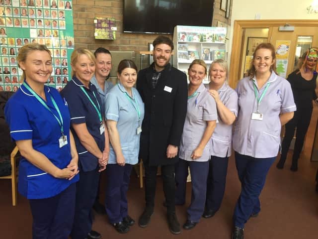 Jordan with staff at Pendleside Hospice where he is an ambassador and has helped to raise thousands of pounds for.