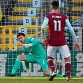 Burnley's English goalkeeper Nick Pope (L) makes a save during the English Premier League football match between Burnley and Everton at Turf Moor in Burnley, north west England on December 5, 2020.