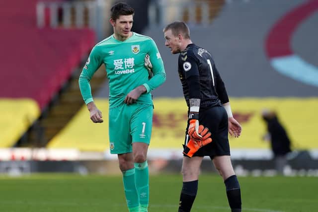 Burnley's English goalkeeper Nick Pope (L) and Everton's English goalkeeper Jordan Pickford talk after the English Premier League football match between Burnley and Everton at Turf Moor in Burnley, north west England on December 5, 2020.