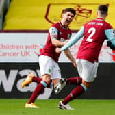 Burnley's Irish midfielder Robbie Brady (L) celebrates scoring the opening goal during the English Premier League football match between Burnley and Everton at Turf Moor in Burnley, north west England on December 5, 2020.