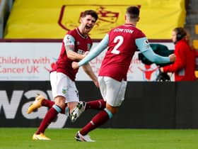 Burnley's Irish midfielder Robbie Brady (L) celebrates scoring the opening goal during the English Premier League football match between Burnley and Everton at Turf Moor in Burnley, north west England on December 5, 2020.