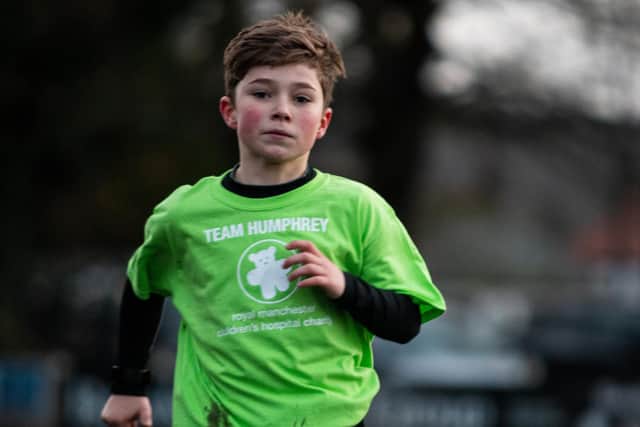 Young Burnley fan Freddie Xavi en route to completing another two kilometre run