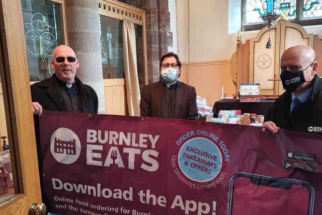 Karl Greenwood of Burnley Eats (right) at the company's first hamper presentation to Pastor Mick Fleming (left) of Church on the Street and the Rev Alex Frost of St Matthew's Church, Burnley