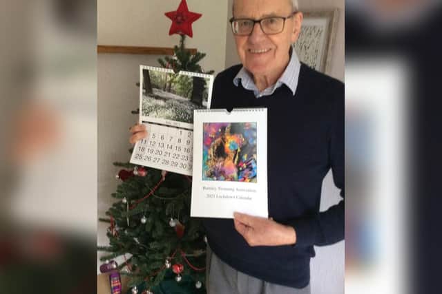 David Smith, chairman of the Burnley Twinning Association, with the group's 'lockdown calendar.'