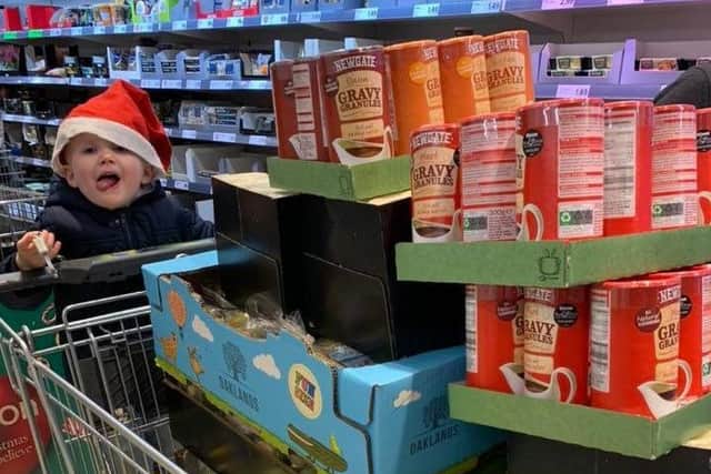Harrison helps out with some of the shopping for Hacker's Christmas Dinner last year.