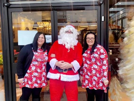 Francesca Footwells and Michelle Middleton outside Quick Crepes with Father Christmas