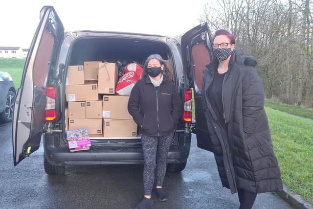 A van full of gifts are dropped off for the Christmas Toy Appeal thanks thanks to the £500 raised through a raffle organised by Lucy Whitehall ( right)