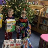 Isabelle Starr, George Davis and William Aspinall, pupils at St Stephen's Primary School, with some of the items donated for Healthier Heroes.