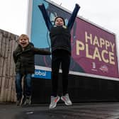 Jordan North's nephews (l-r) Seb and Austin outside the billboard at Turf Moor, Burnley. Photo: Kelvin Stuttard